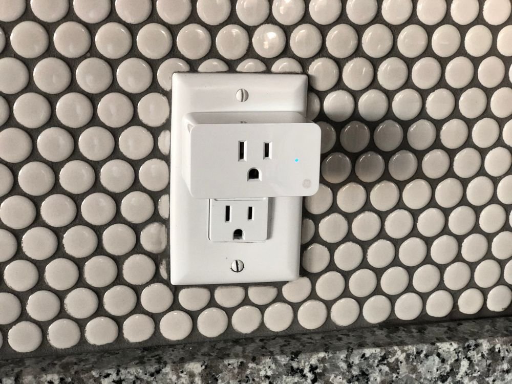 Smart plug installed on a wall outlet